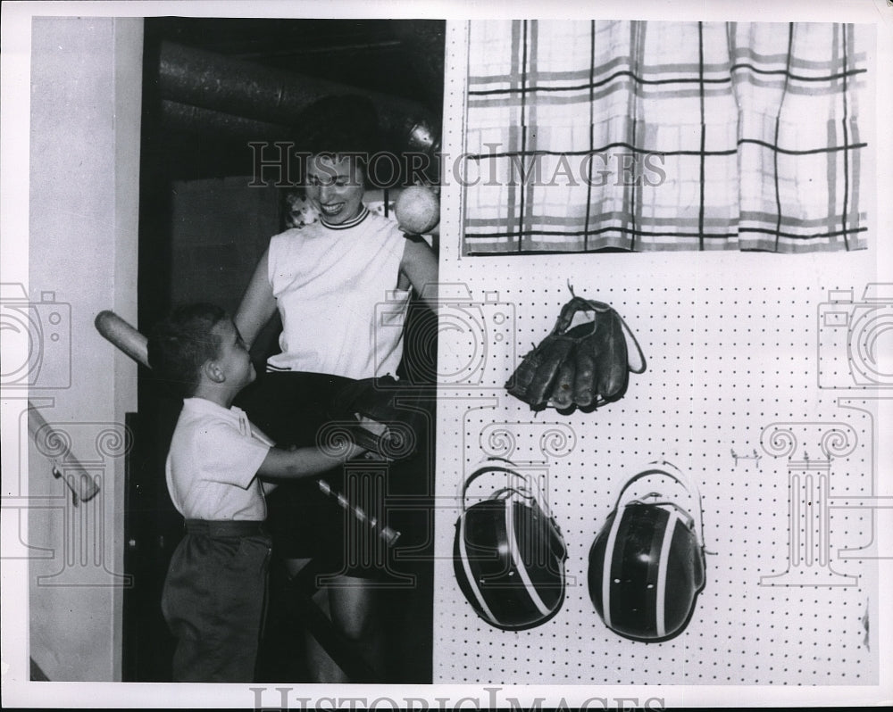 Press Photo Young Person Speaking To Mom About Baseball Holding Equipment - Historic Images