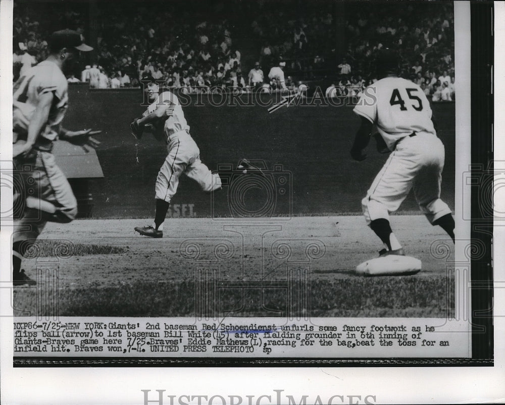 1956 Press Photo NY Giants&#39; Red Schoendienst flips ball to Bill White vs Braves-Historic Images