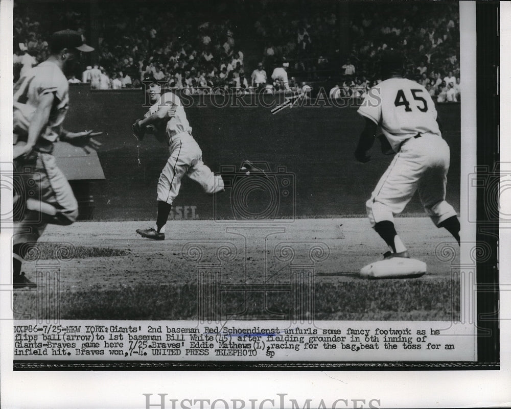 1956 Press Photo NY Giants' Red Schoendienst flips ball to Bill White vs Braves-Historic Images