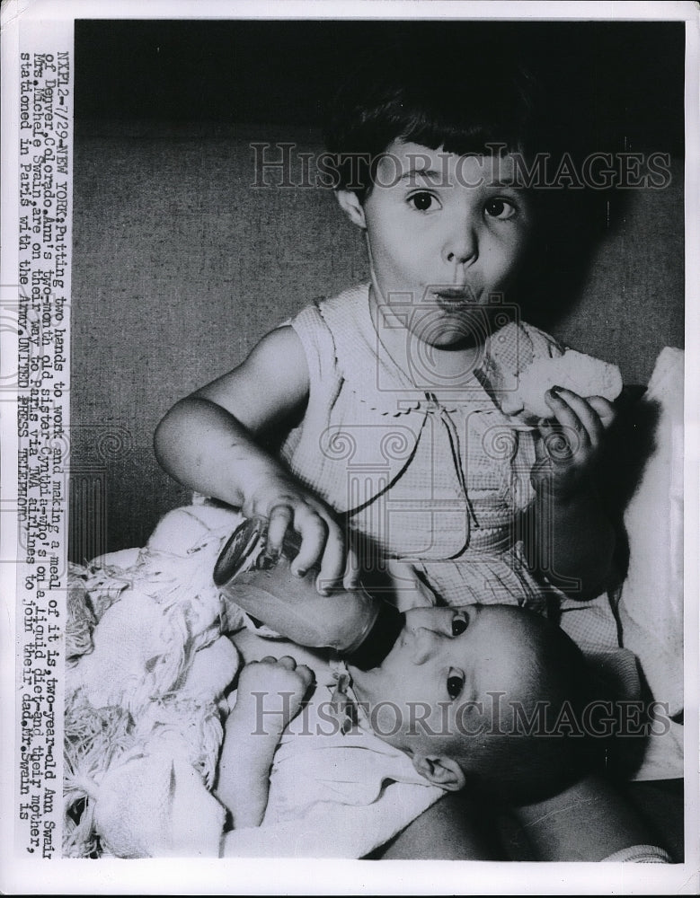 1966 Ann Swain of Colorado Feeds 2 Month Old Sister  - Historic Images