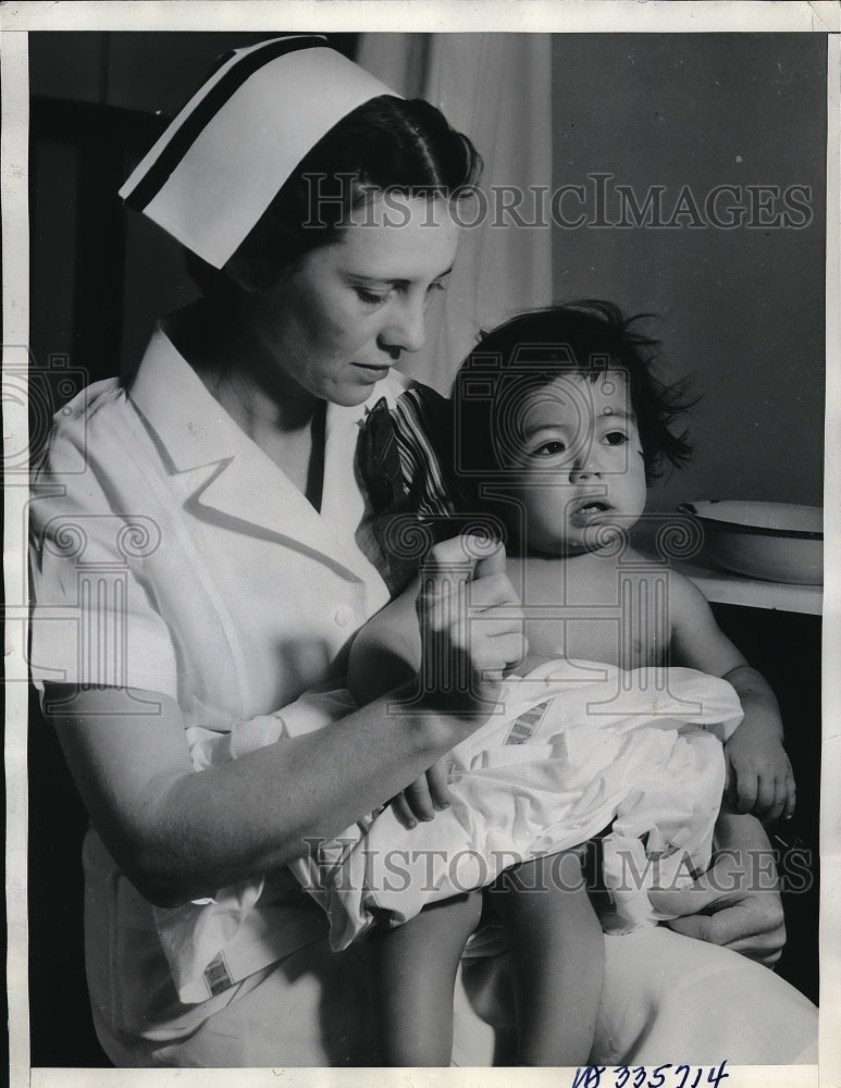 1936 Nurse Maude Caffey &amp; baby Marie Chavez who had stomach pumped - Historic Images