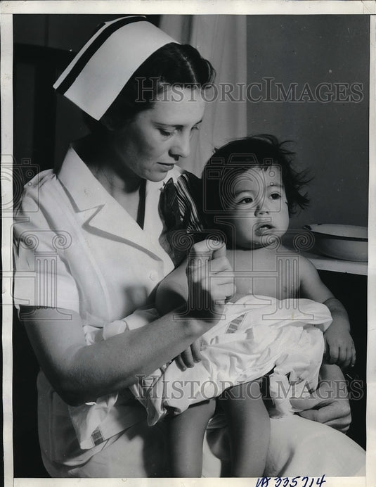 1936 Nurse Maude Caffey & baby Marie Chavez who had stomach pumped - Historic Images