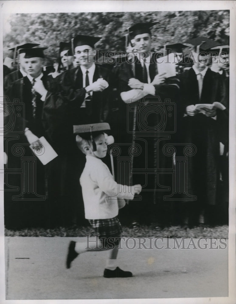 1958 Child Practicing at Graduation Before Mother Caught Him - Historic Images