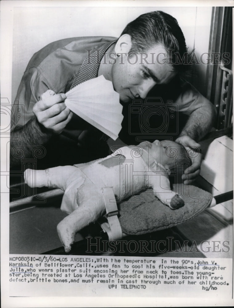 1960 Press Photo John Haralsin with daughter with rare defect brittle bones. - Historic Images