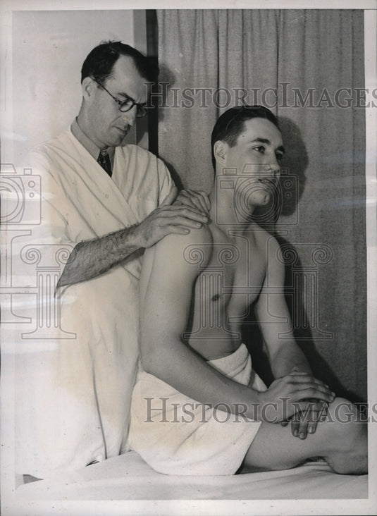 1938 Ken Holloway working on Bob Feller at Holloway's Health Studio-Historic Images