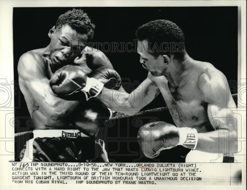 1956 Press Photo Orlando Zulueta Hits Jaw of Ludwig Lightburn, Lightweight - Historic Images