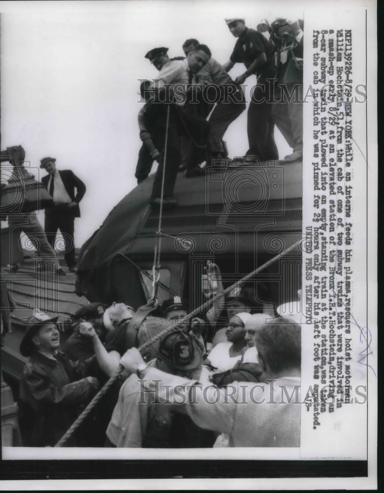 1957 Press Photo William Hochstein rescued from NYC subway train accident - Historic Images