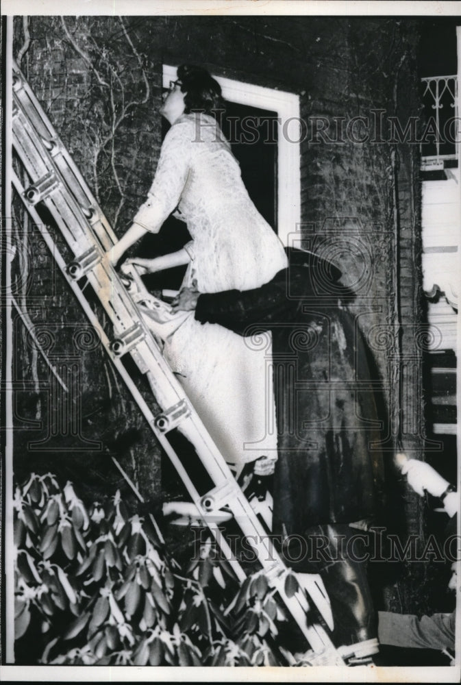 1961 Press Photo Mrs.Nelson A. Rockefeller helped down ladder by firemen-Historic Images