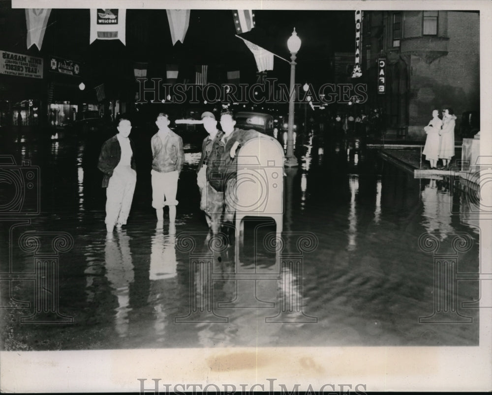 1938 Anaconda, Minn. Citizens stand in flood waters from resovoir - Historic Images