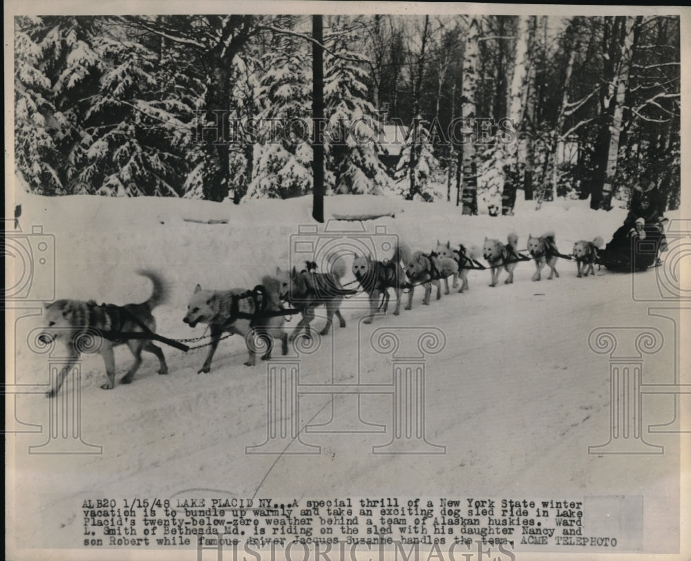 1948 Press Photo Ward Smith Of Bethesda, MD Rides Dog Sled Near Lake Placid, NY - Historic Images