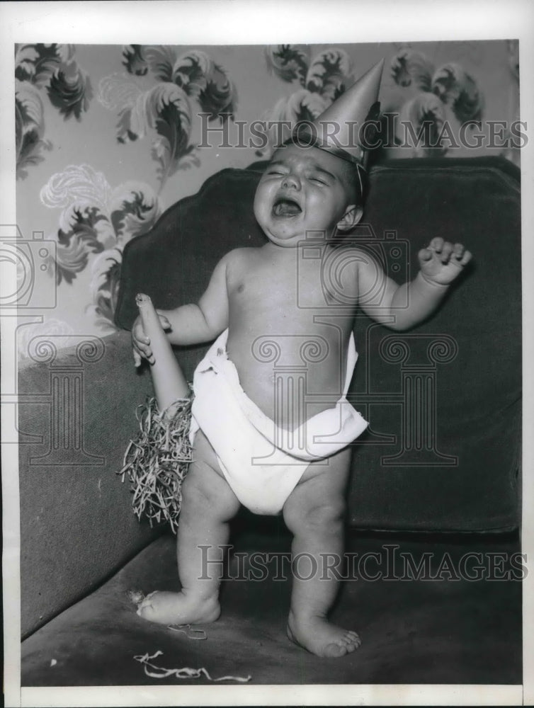 1946 Louis Agerra at Five Months Rings in New year - Historic Images