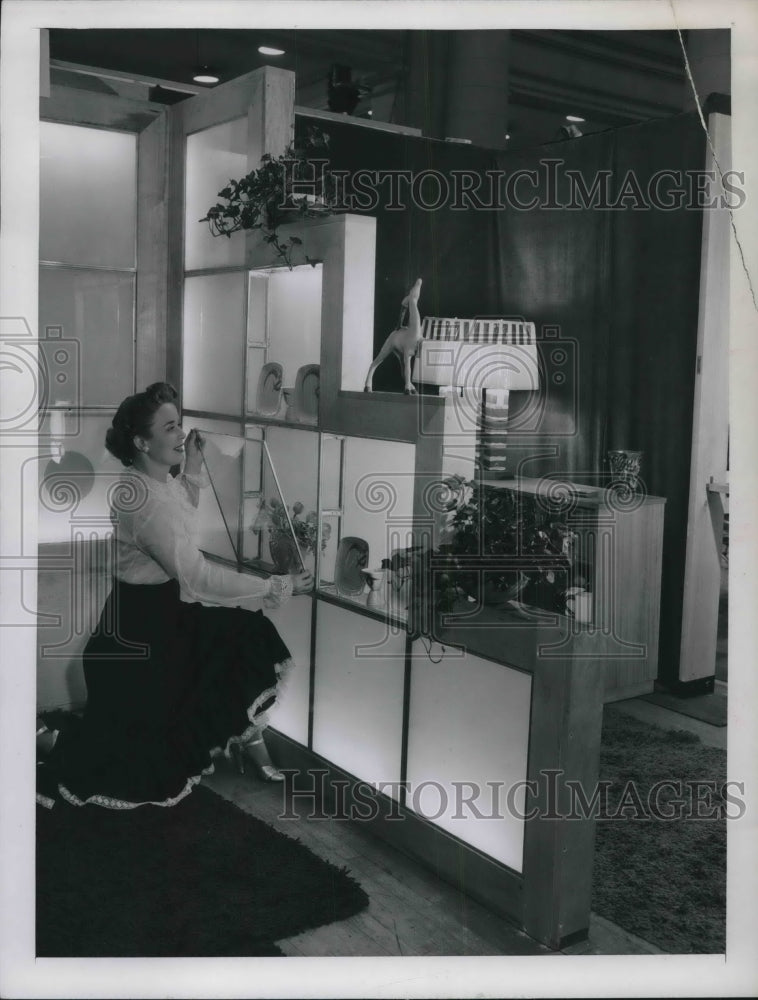 1948 A woman cleaning structural glass blocks in a home-Historic Images