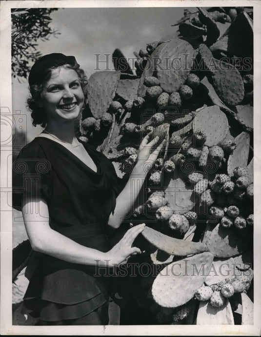 1959 Weldon Woodson & a cuctus plant in bloom-Historic Images
