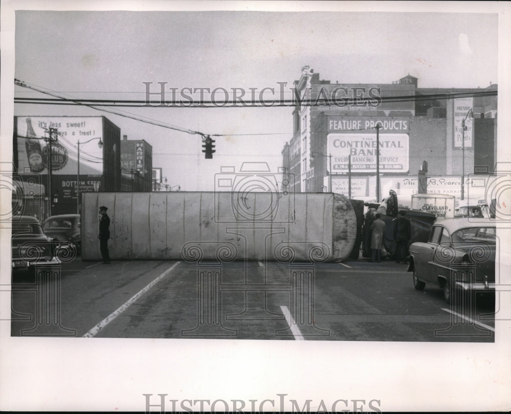 1956 Press Photo A overturned tractor trailer in downtown Cleveland, Ohio-Historic Images