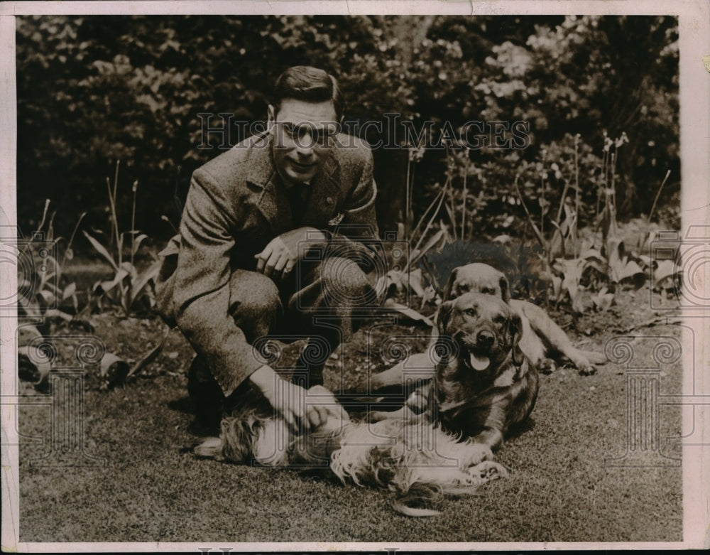 1936 Luke playing with three dogs-Historic Images