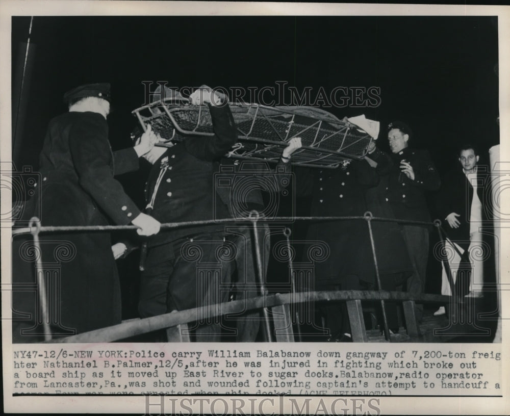 1949 Press Photo Police carrying William Balabanow off of ship - neb49444-Historic Images