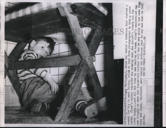 1952 Press Photo Boston, Mass.Jimmy Hartigan, age 4 hiding & thought missing - Historic Images