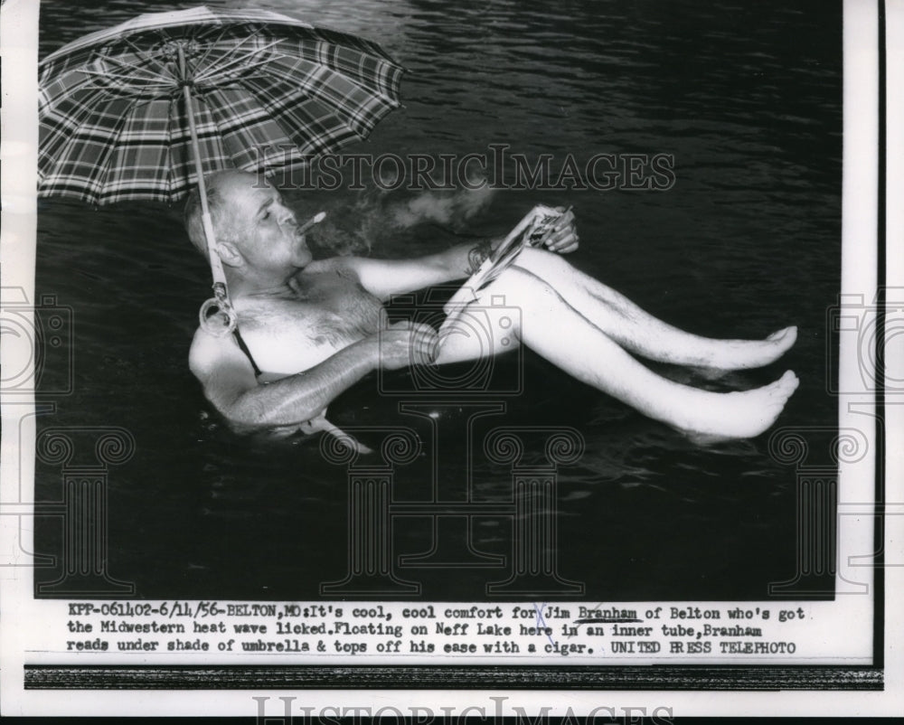 1956 Press Photo Jim Branham Rides Inner Tube To Beat The Heat - Historic Images