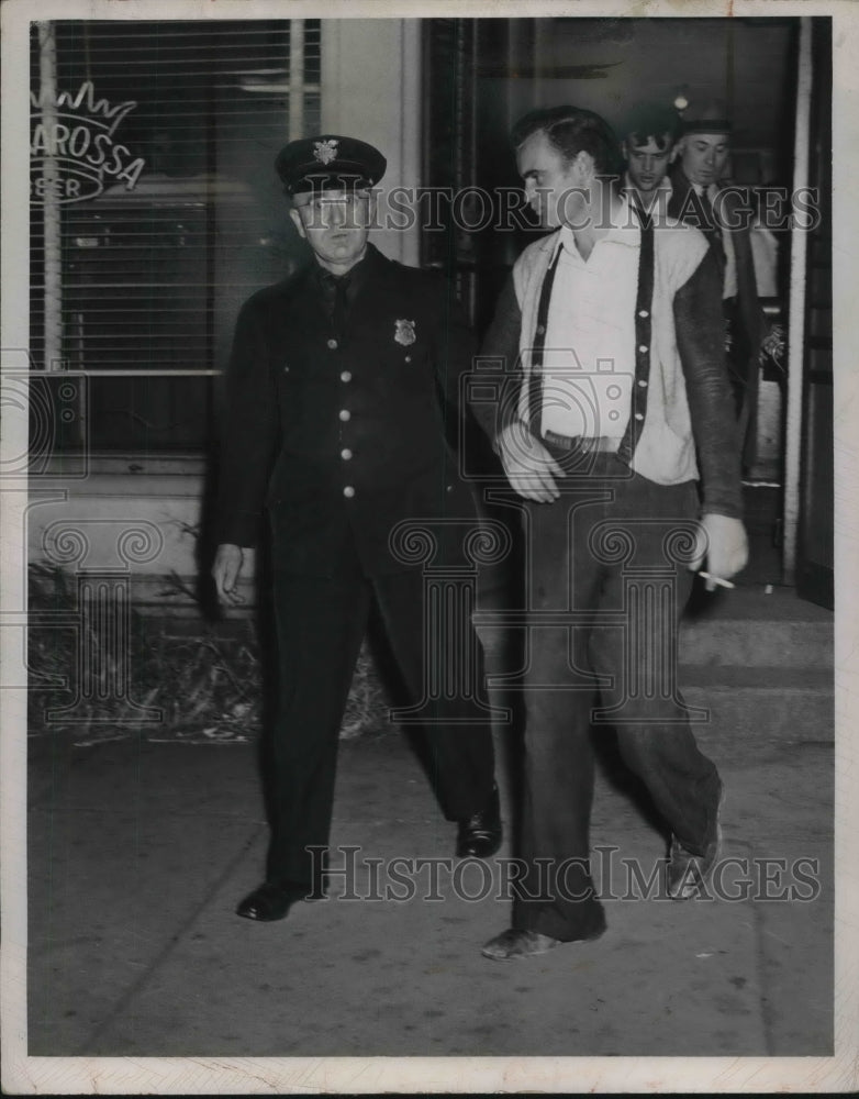 1947 Press Photo An unidentified person under arrest-Historic Images