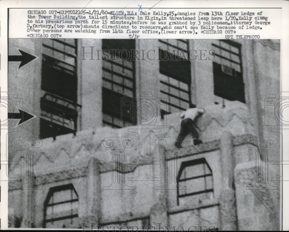 1960 Dale Kelley dangles from the 13th floor ledge of the Tower - Historic Images