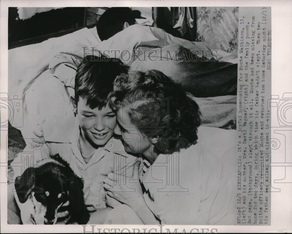 1951 Monte Mathison reunited with family after missing for two days. - Historic Images