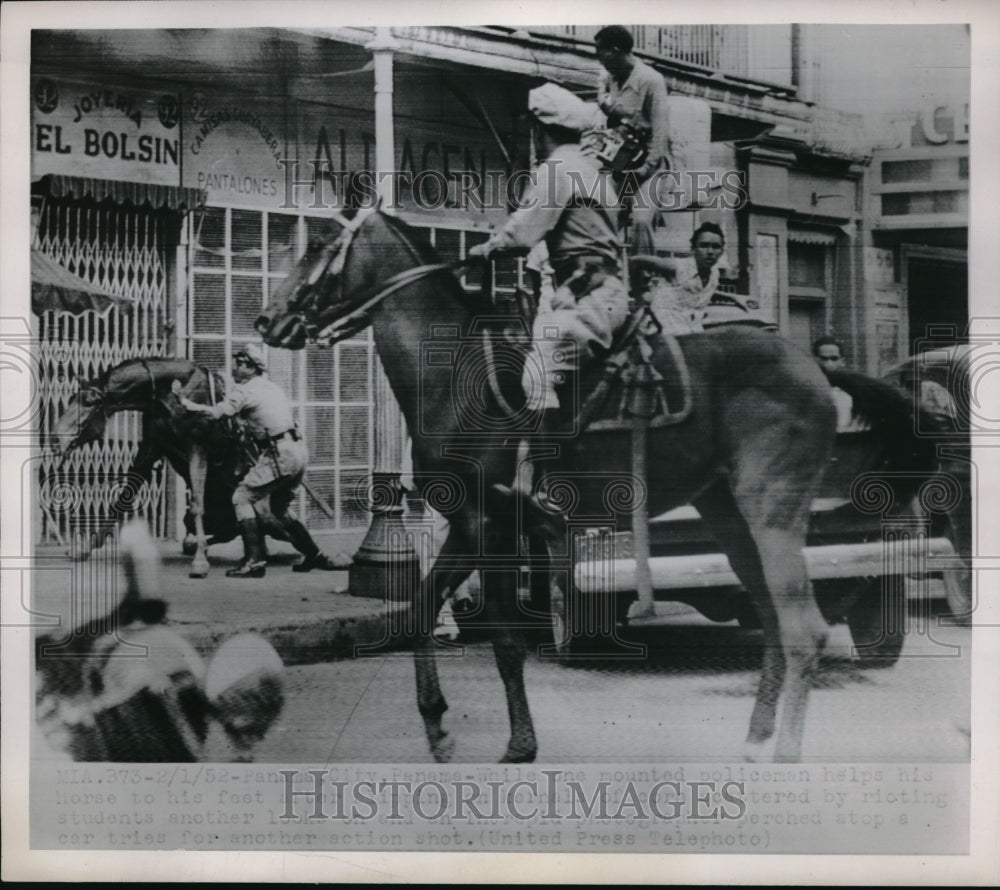 1952 Press Photo Policeman Helps Horse to Feet While Other Stops Rioting Student - Historic Images