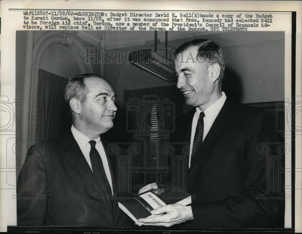 1962 Press Photo budget director David Bell gives budget copy to Kermit Gordon-Historic Images