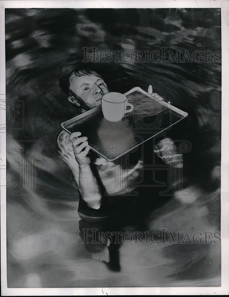 1957 Oliver Johnson Holds Tray &amp; Cup Level Above Water - Historic Images