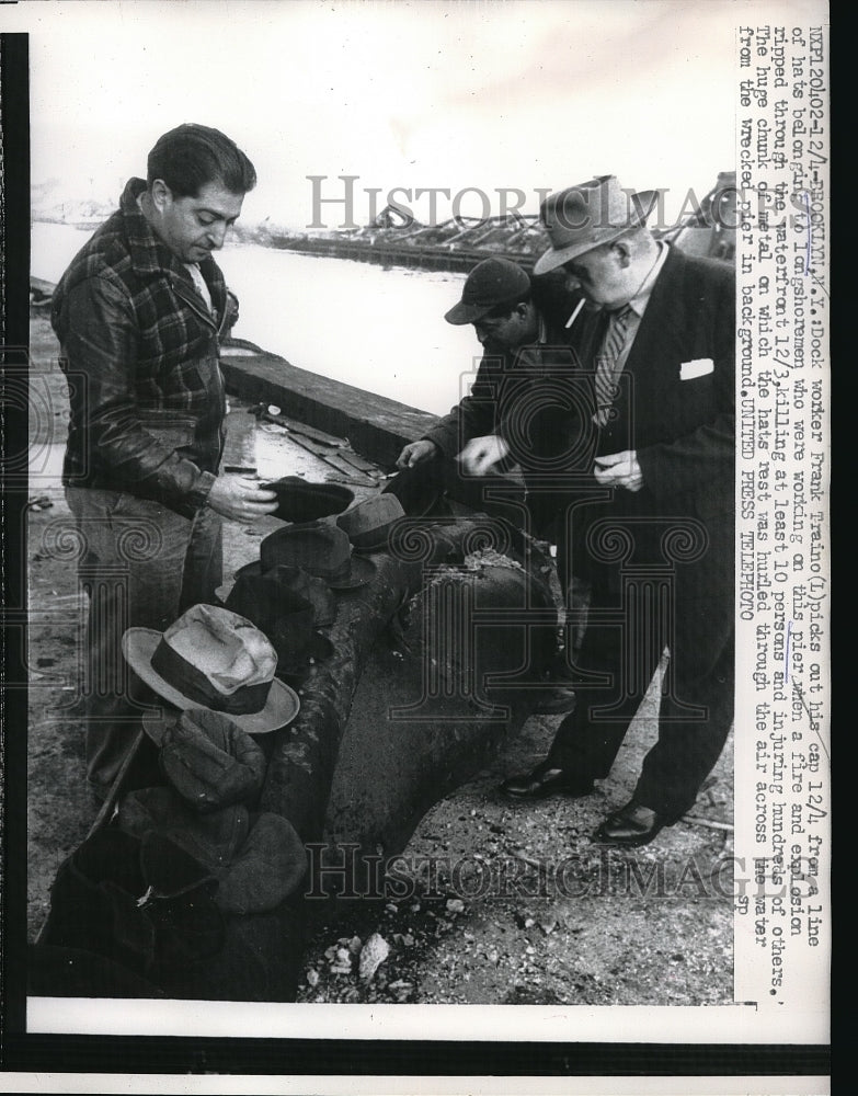 1956 Press Photo Dock Worker Frank Traino Finds His Hat After Fire - Historic Images