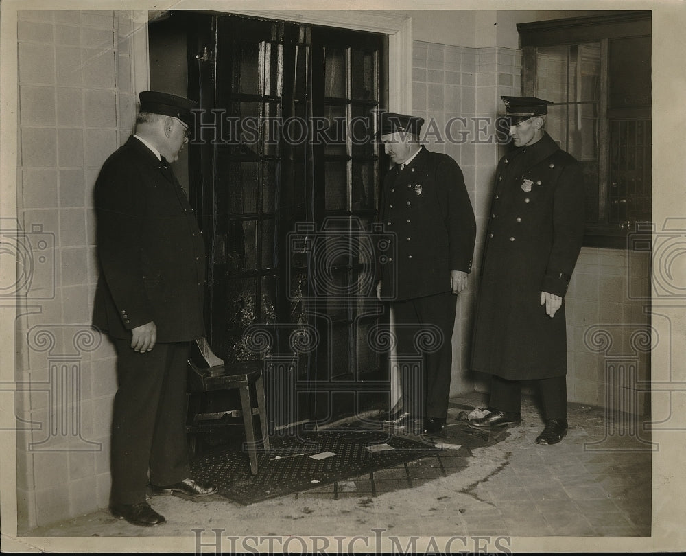 1929 Guards Looking at Broken Glass in a Door - Historic Images