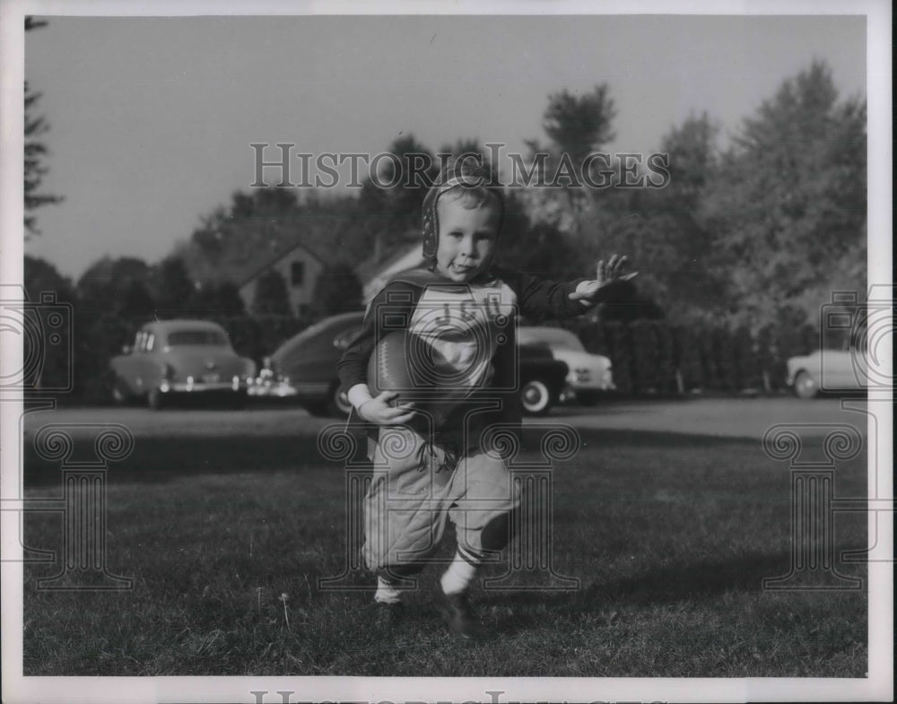 1951 Greg Wetzel of Cleveland, Ohio, baby with football - Historic Images