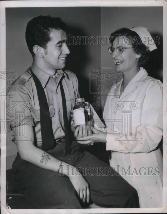 1951 Press Photo Sgt. John Martinez Gives Blood to Red Cross, Madge D'Alessandro-Historic Images