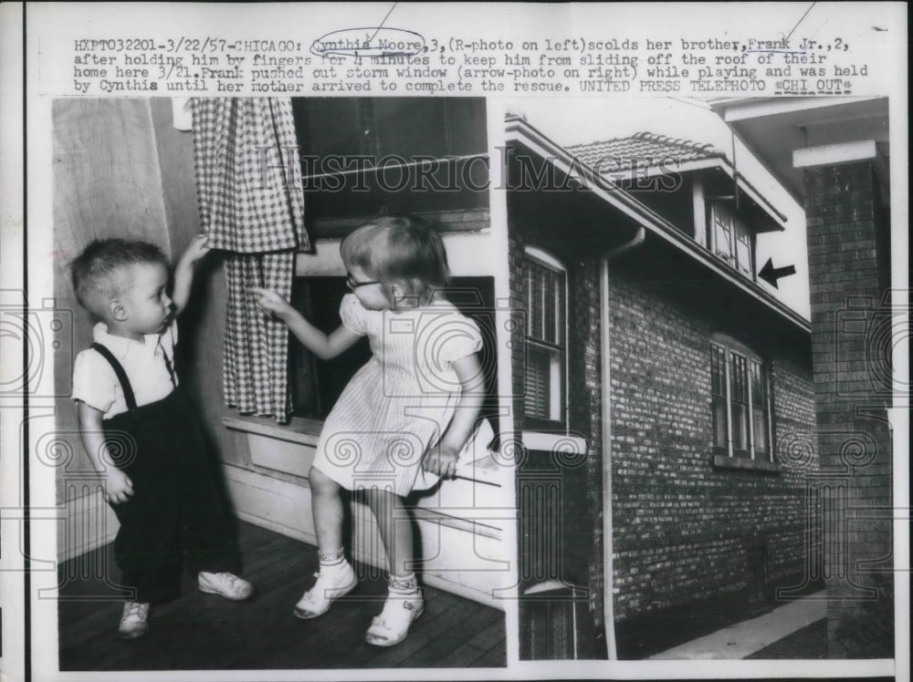 1957 Cynthia Moore with brother Frank Jr. after rescuing him from - Historic Images