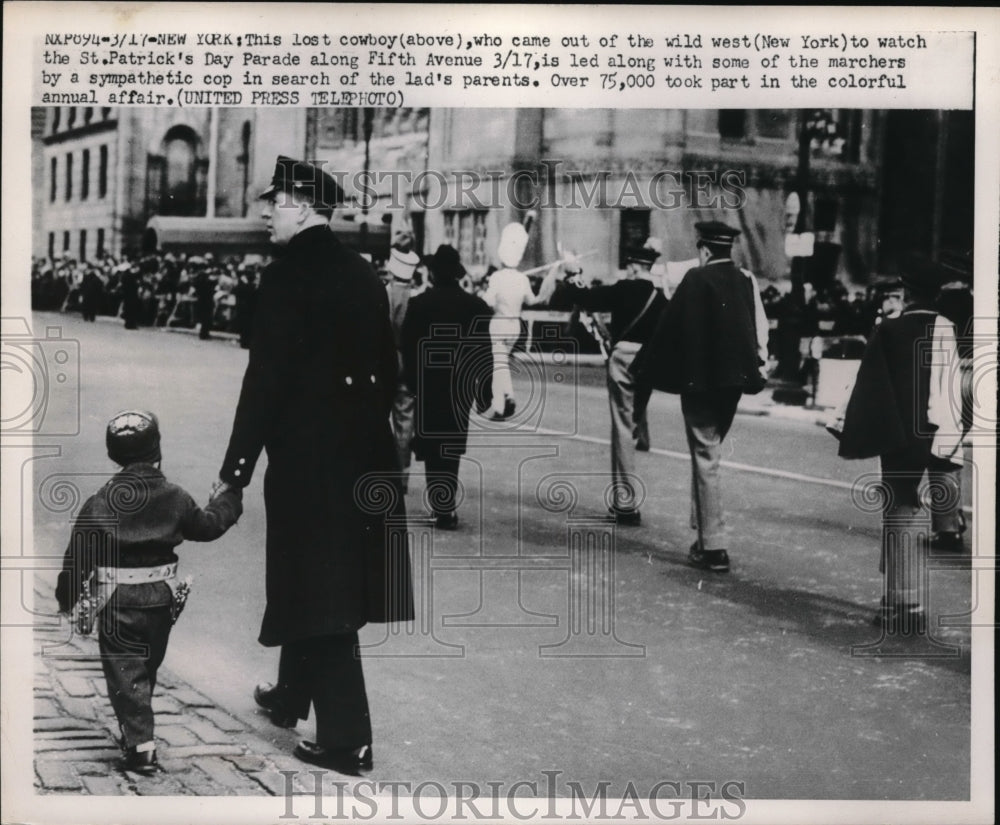 1952 lost boy gets help from cop during St. Patrick&#39;s Day parade, NY - Historic Images