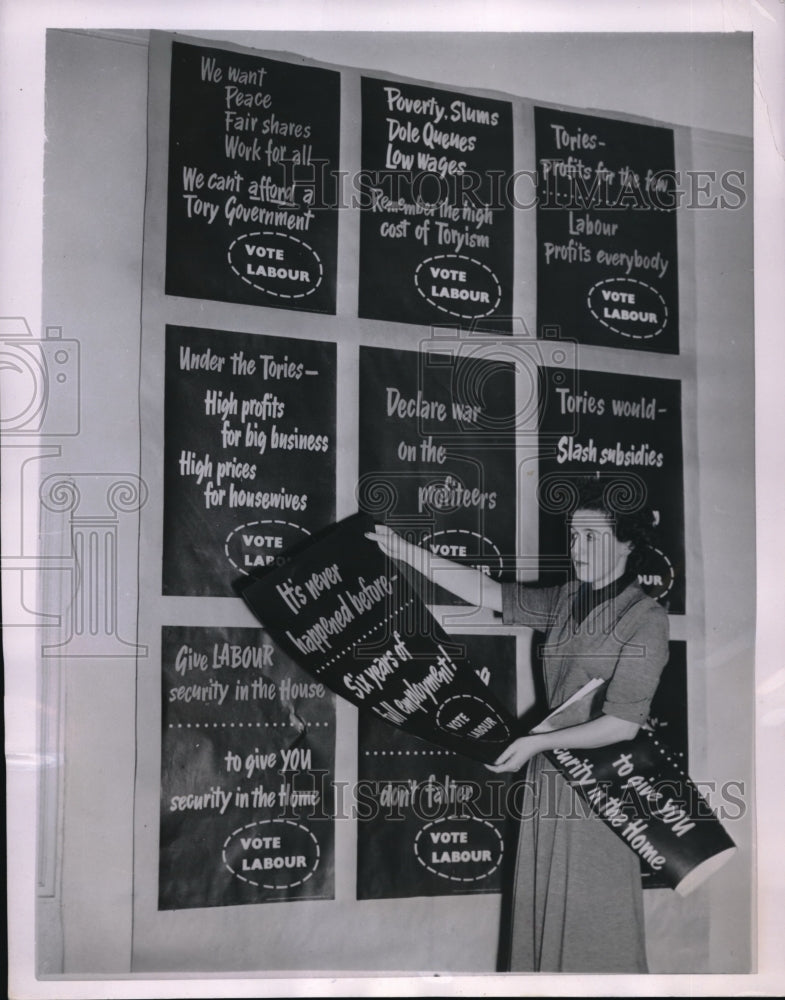 1951 Press Photo London, Miss Joyce Worley &amp; election posters - Historic Images