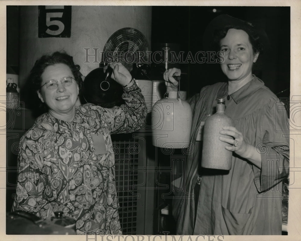 1950 Mrs Paul Holder &amp; Mrs RW Davis Hold Bottles  - Historic Images