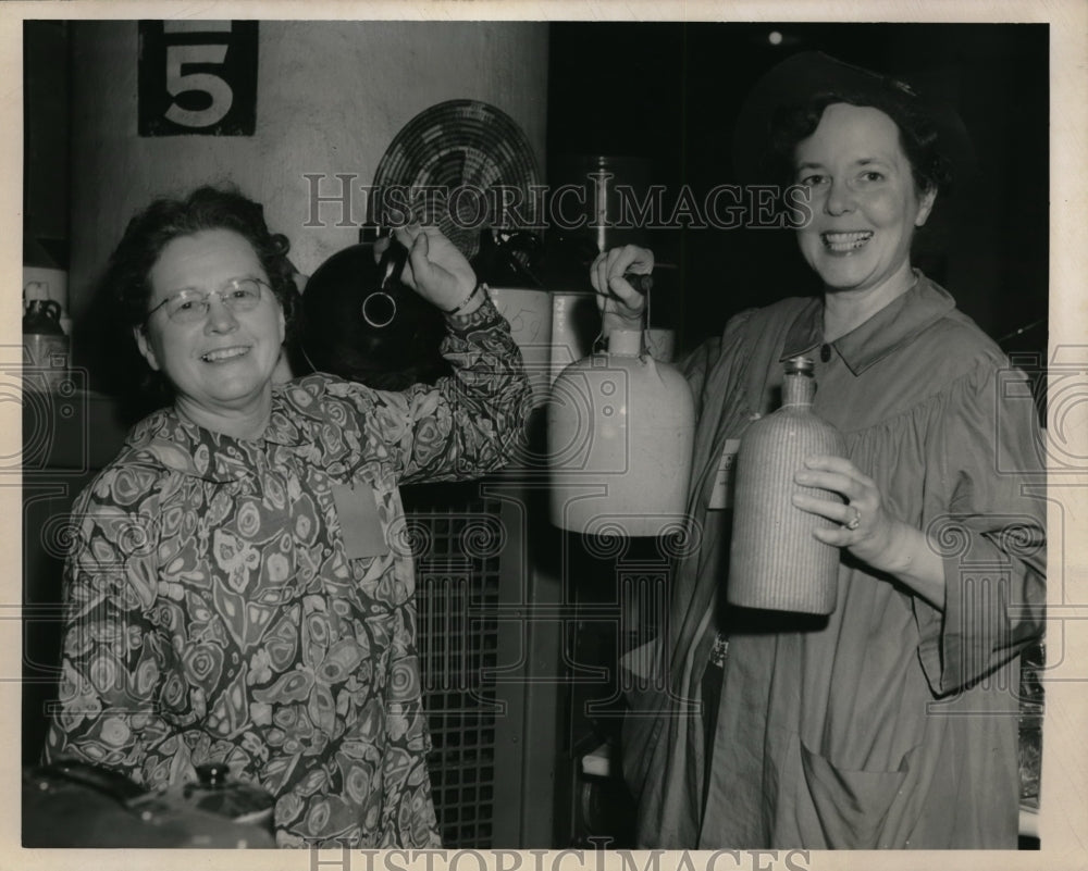 1950 Mrs Paul Holder & Mrs RW Davis Hold Bottles  - Historic Images