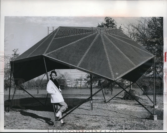 1960 Carole Roberson taking shelter under the Icosahedron on the - Historic Images