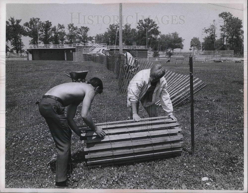 1969 Jack Waggoner and Chris Robison set up snow fence in Lakewood - Historic Images