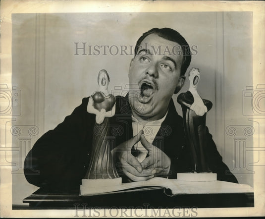 1947 Tenor singer Donald Dare & collection of statuettes - Historic Images