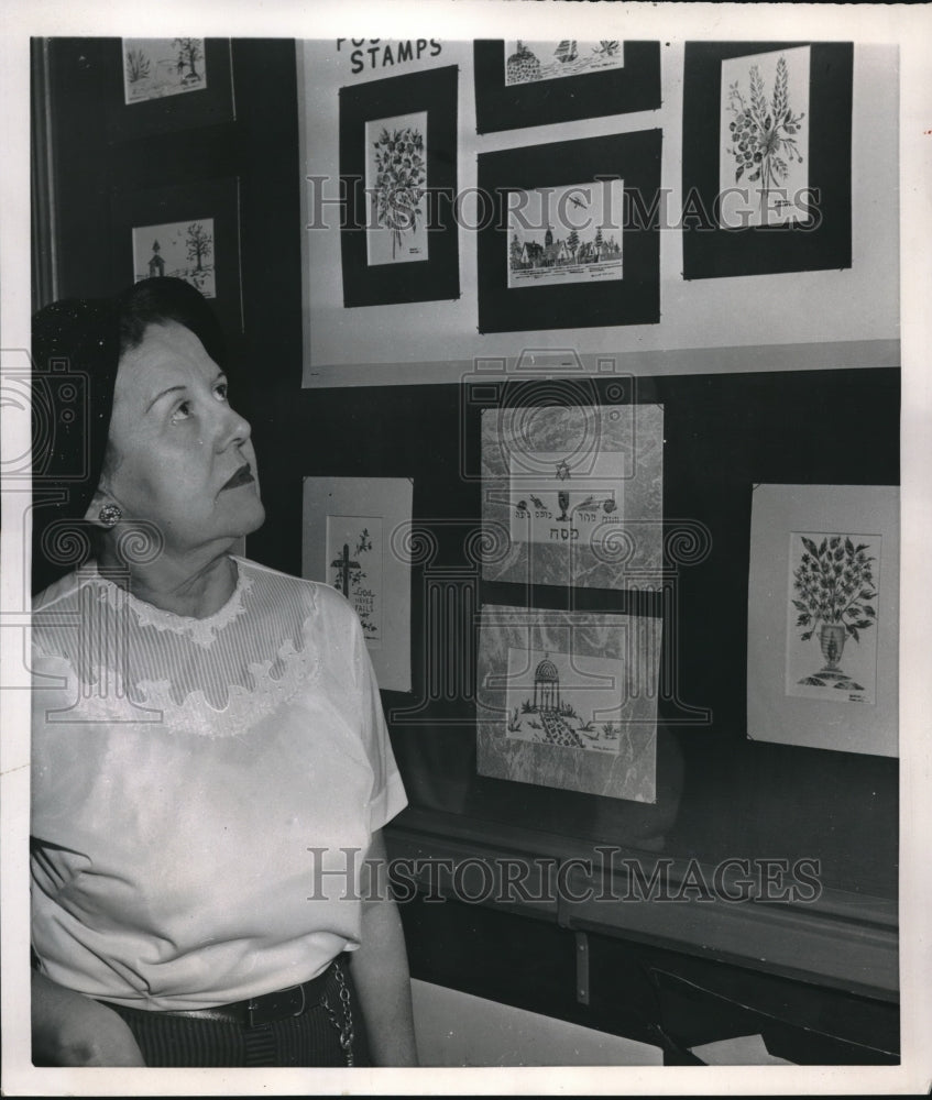 1952 Press Photo Berthe Marcotte Mitchell looks over art made of stamps-Historic Images