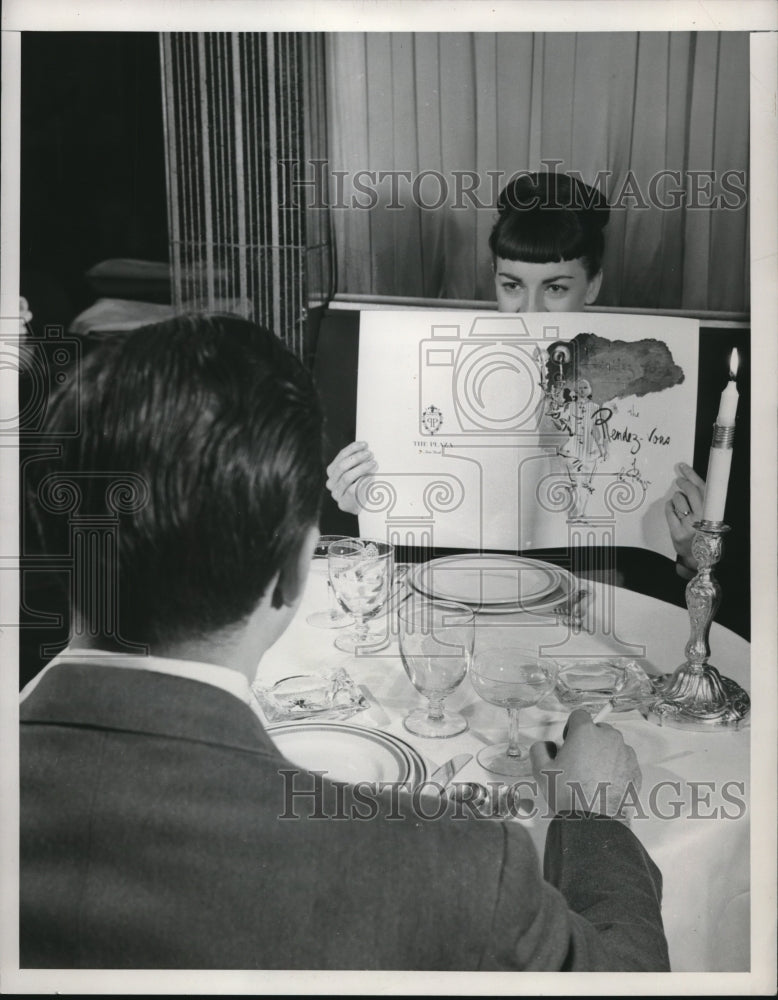 1948 Press Photo Actress Allyn McLerie going through the menu of this restaurant - Historic Images