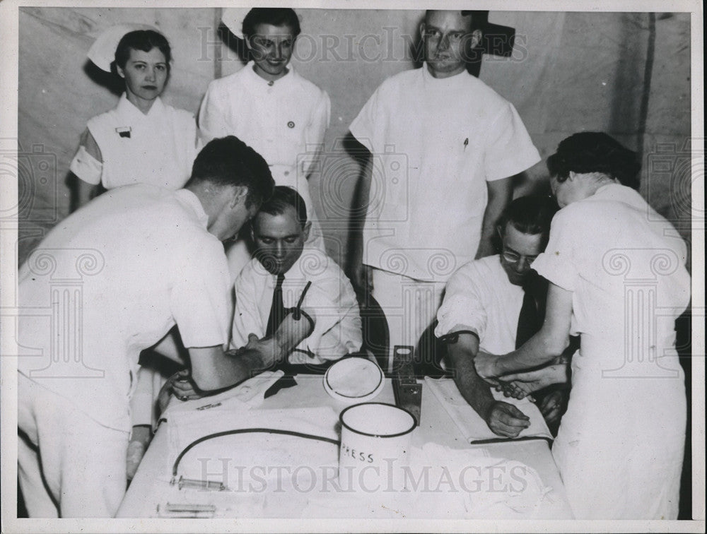 1937 Press Photo Nurses taking blood from donors at a blood drive - neb67846 - Historic Images