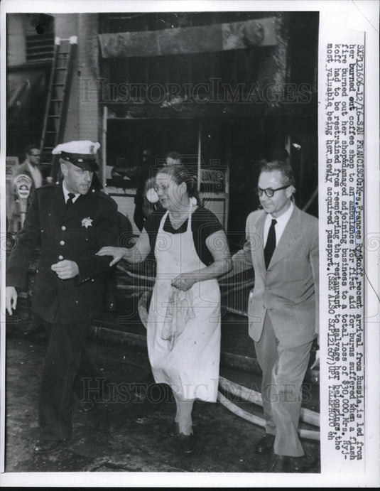 1959 Press Photo Mrs.Frances Ryjkoff is led from her burned coffee shop- Historic Images