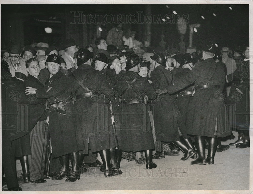 1938 Paris Guards form the crowd for the arrival of British Minister - Historic Images