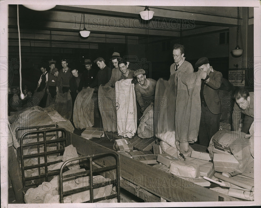 1936 General Post Office Workers dumping bags of Christmas Package - Historic Images