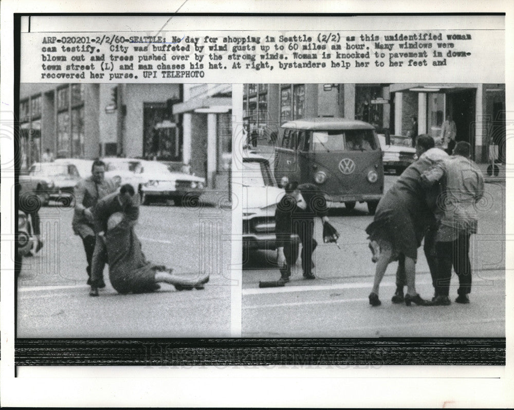 1960 Press Photo Woman hit by Wind gust to 60 miles per hour in Seattle - Historic Images