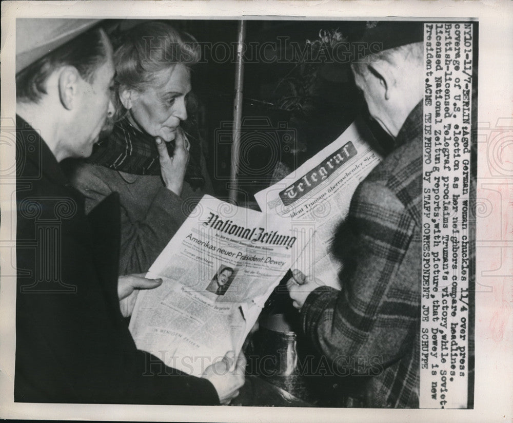 1948 Press Photo German Woman Laughs Reading Paper Of US Elections - Historic Images