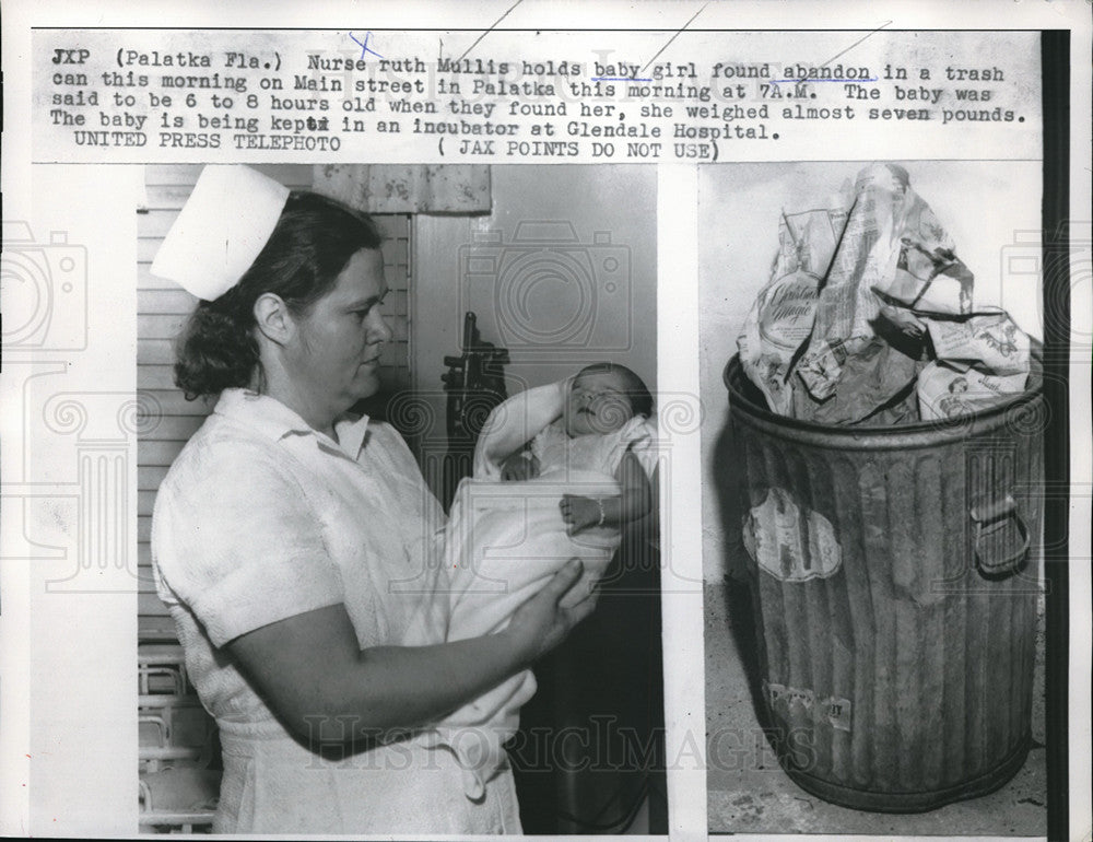 1957 Press Photo Nurse Ruth Mullis holds baby girl found abandoned Glendale - Historic Images