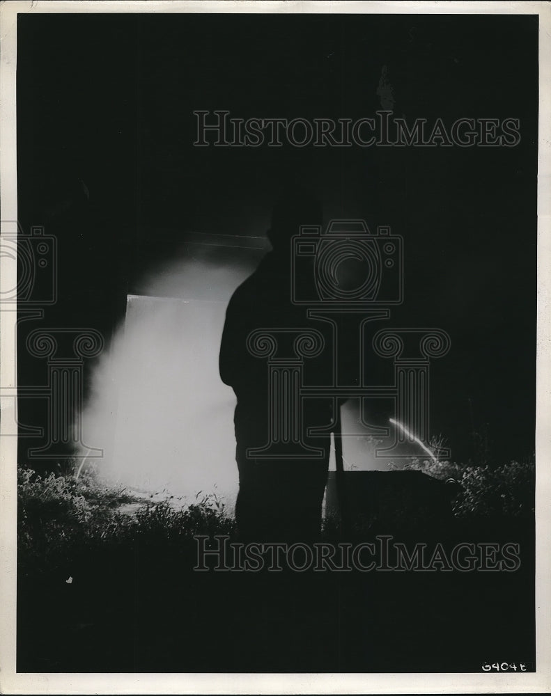 19436 Press Photo Chemical Warfare Soldier Uses Small Hose on Thermite Bomb-Historic Images